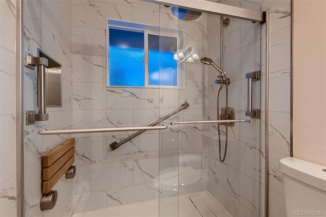 bathroom with toilet and walk in shower