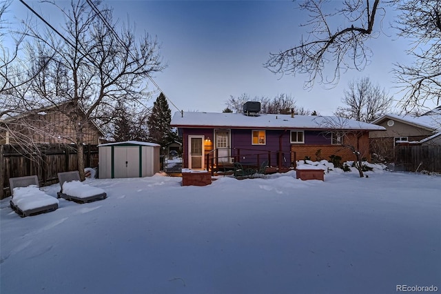 view of front of house with a storage unit