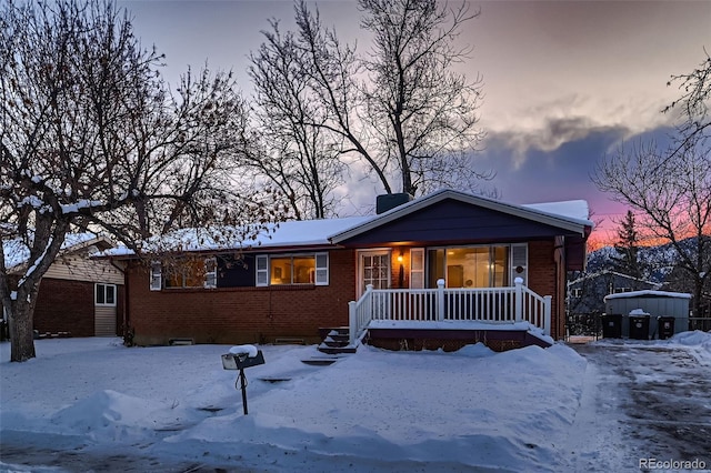 ranch-style home with covered porch