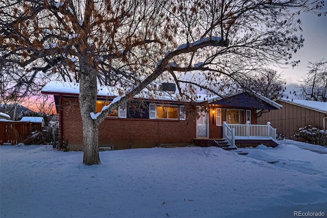 ranch-style home with a porch