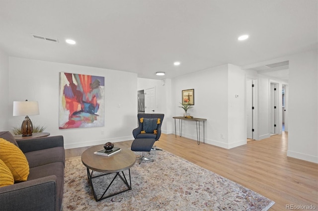 3025 Ivanhoe St, Denver, CO 80207 - living room featuring light wood-style flooring and recessed lighting