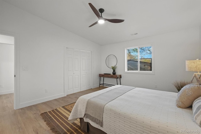 3025 Ivanhoe St, Denver, CO 80207 - bedroom featuring light wood-style floors, lofted ceiling, a closet, and ceiling fan