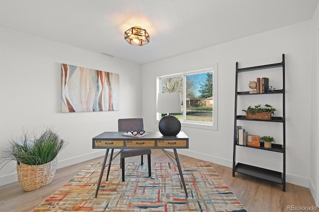 3025 Ivanhoe St, Denver, CO 80207 - office space featuring wood finished floors and baseboards