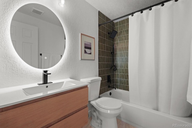 3025 Ivanhoe St, Denver, CO 80207 - bathroom with a textured wall, vanity, shower / tub combo with curtain, and a textured ceiling