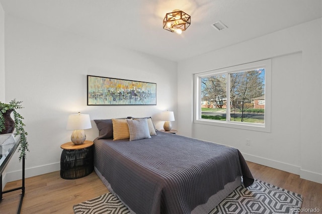 3025 Ivanhoe St, Denver, CO 80207 - bedroom featuring baseboards and wood finished floors