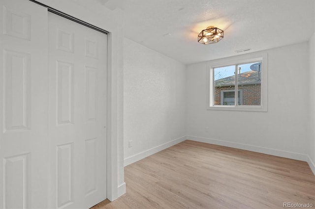 3025 Ivanhoe St, Denver, CO 80207 - unfurnished bedroom with light wood-type flooring and baseboards