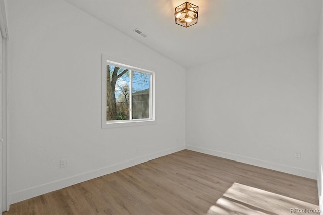 3025 Ivanhoe St, Denver, CO 80207 - unfurnished room featuring lofted ceiling and wood finished floors