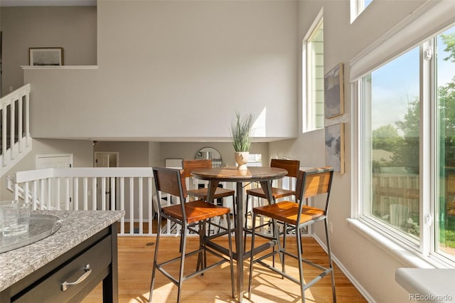 9698 Queenscliffe Dr, Highlands Ranch, CO 80130 - dining space with light wood-style floors and baseboards