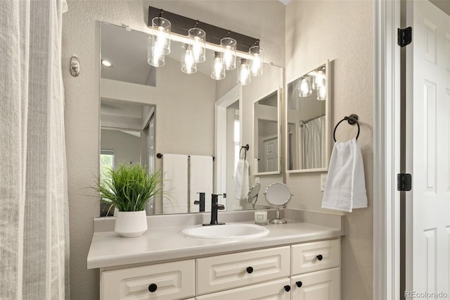 9698 Queenscliffe Dr, Highlands Ranch, CO 80130 - bathroom with vanity and a textured wall