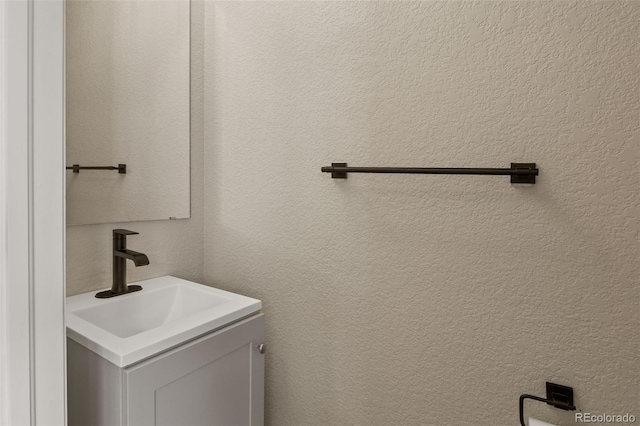9698 Queenscliffe Dr, Highlands Ranch, CO 80130 - bathroom with vanity and a textured wall