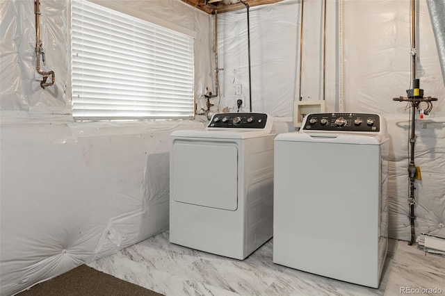 9698 Queenscliffe Dr, Highlands Ranch, CO 80130 - laundry area featuring washer and dryer and light marble finish floors