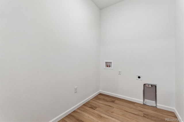 19110 E 96th Pl, Commerce City, CO 80022 - washroom featuring hookup for a washing machine, electric dryer hookup, light wood-style flooring, and baseboards