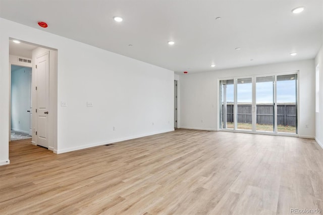 19110 E 96th Pl, Commerce City, CO 80022 - spare room with light wood-style flooring, baseboards, and recessed lighting