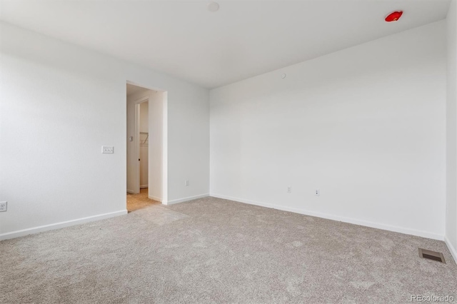 19110 E 96th Pl, Commerce City, CO 80022 - spare room featuring light colored carpet and baseboards