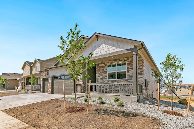 view of front of house featuring a garage and covered porch