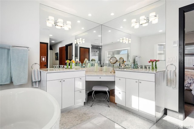 bathroom with vanity and a tub to relax in