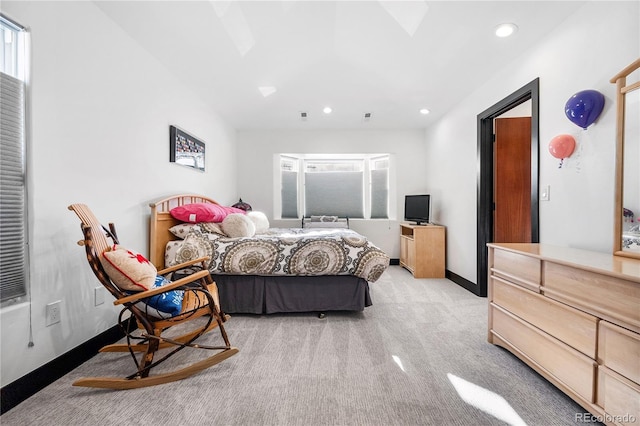 carpeted bedroom with multiple windows