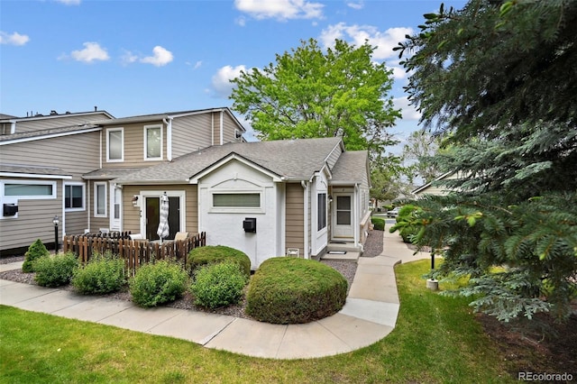 11565 Decatur St Unit 7D, Denver, CO 80234 - view of front of house with roof with shingles and a front lawn