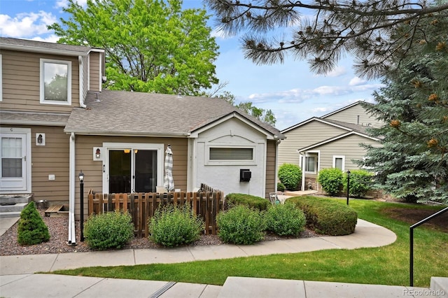 11565 Decatur St Unit 7D, Denver, CO 80234 - view of front of house with roof with shingles and a front lawn