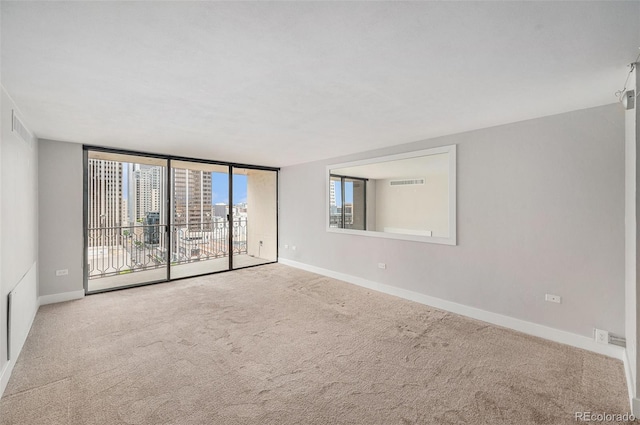 1020 15th St Unit 18I, Denver, CO 80202 - unfurnished room with baseboards and carpet flooring