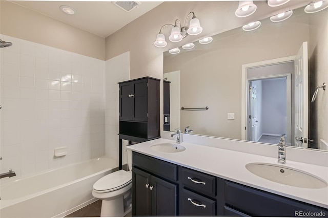 full bathroom with toilet, vanity, tile patterned floors, and tiled shower / bath combo