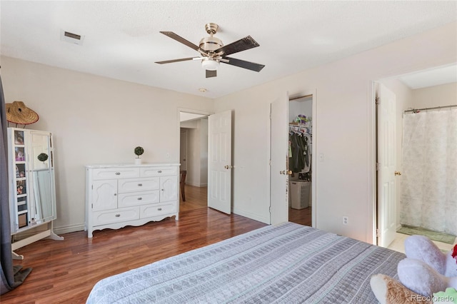 15627 E 51st Dr, Denver, CO 80239 - bedroom featuring visible vents, ensuite bathroom, a ceiling fan, wood finished floors, and baseboards