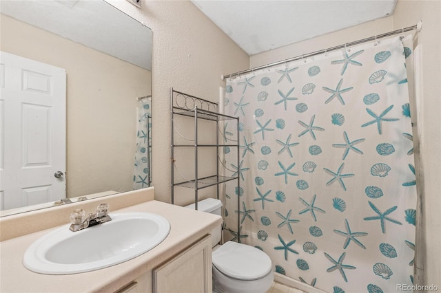 15627 E 51st Dr, Denver, CO 80239 - full bathroom featuring toilet, a shower with curtain, a textured wall, and vanity