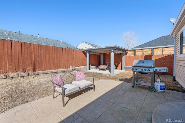 15627 E 51st Dr, Denver, CO 80239 - view of patio with an outdoor fire pit, grilling area, and a fenced backyard
