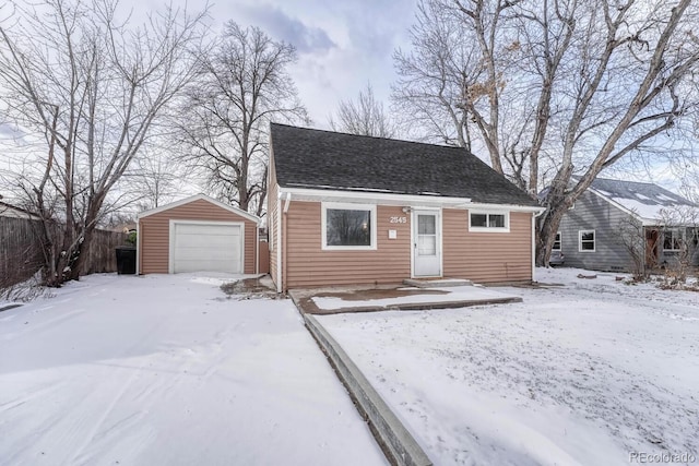 view of front of house featuring an outdoor structure and a garage