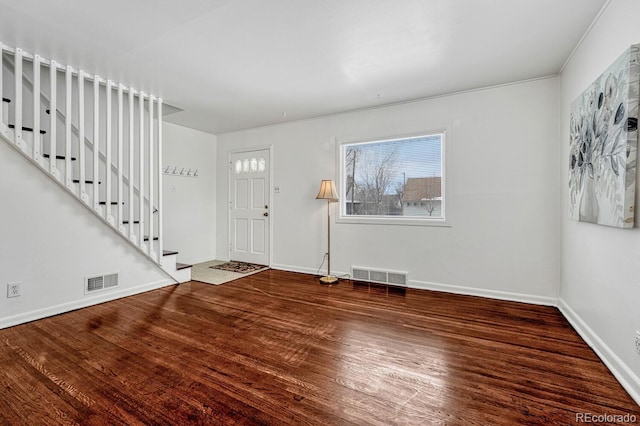 foyer entrance with hardwood / wood-style flooring