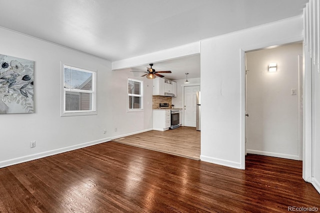 unfurnished living room with ceiling fan and hardwood / wood-style floors