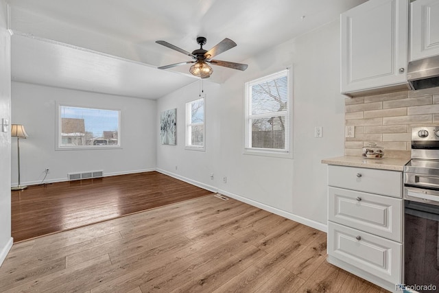 interior space with ceiling fan and light wood-type flooring