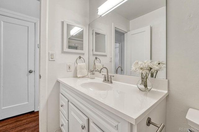 bathroom featuring hardwood / wood-style floors and vanity