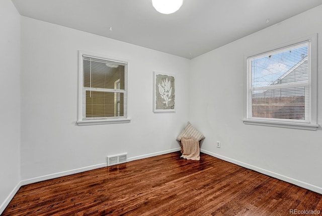 empty room featuring wood-type flooring