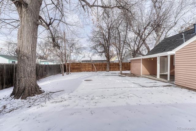 view of yard covered in snow