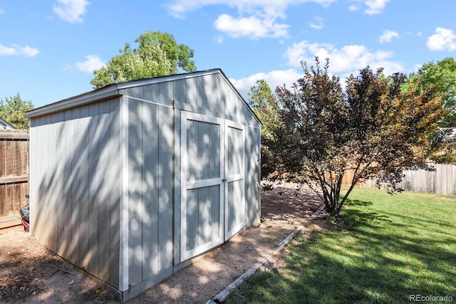 view of shed featuring fence private yard