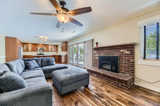 540 Ithaca Dr, Boulder, CO 80305 - living room with dark wood finished floors, a ceiling fan, and a fireplace