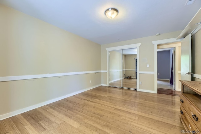 540 Ithaca Dr, Boulder, CO 80305 - unfurnished bedroom with light wood-style flooring and a closet