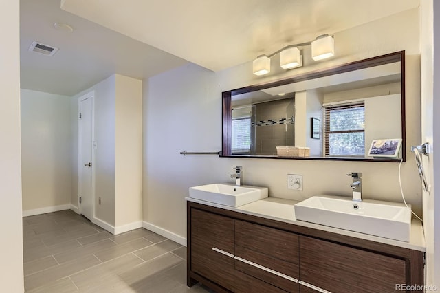 540 Ithaca Dr, Boulder, CO 80305 - bathroom featuring double vanity and tiled shower