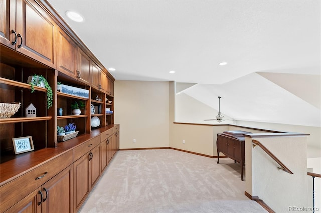 unfurnished office featuring lofted ceiling, recessed lighting, ceiling fan, light carpet, and baseboards