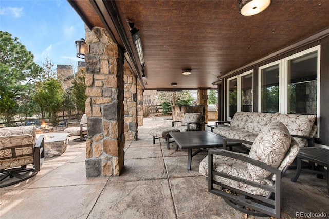 view of patio / terrace featuring a fire pit