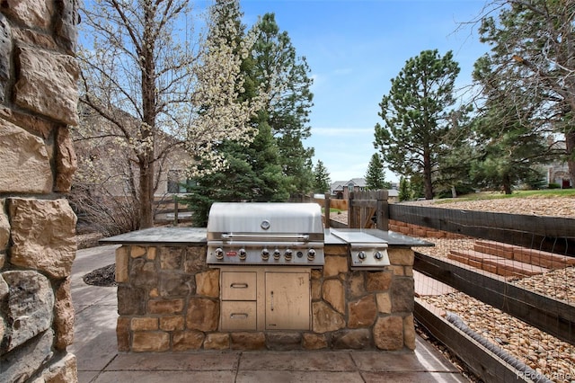 view of patio / terrace featuring grilling area, fence, and area for grilling