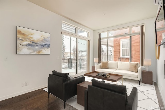 living room featuring light wood-type flooring and baseboards