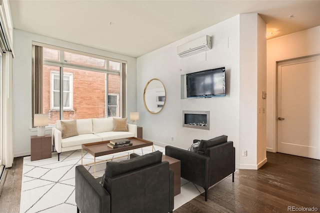 336 E 1st Ave Unit 200, Denver, CO 80203 - living area with a wall mounted air conditioner, wood-type flooring, and a fireplace