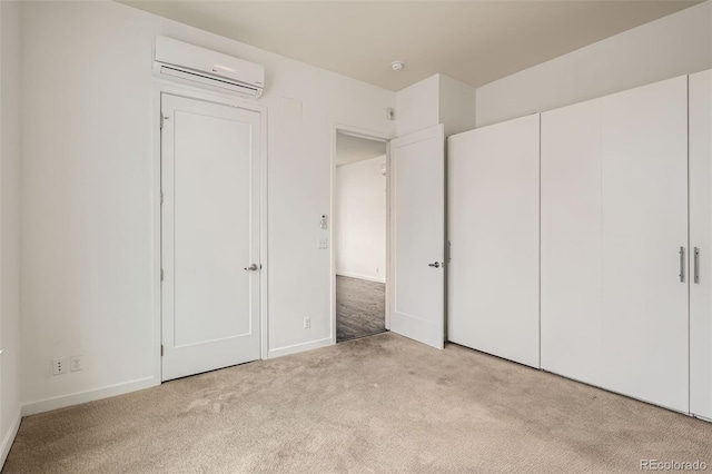 336 E 1st Ave Unit 200, Denver, CO 80203 - unfurnished bedroom featuring a wall mounted AC and carpet floors