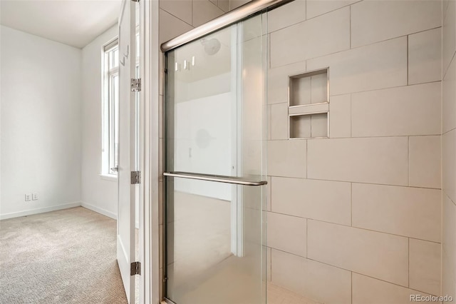 336 E 1st Ave Unit 200, Denver, CO 80203 - full bath featuring a stall shower and baseboards