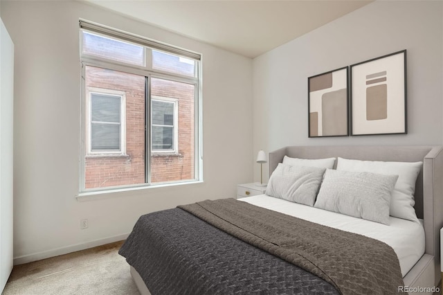 336 E 1st Ave Unit 200, Denver, CO 80203 - carpeted bedroom featuring baseboards