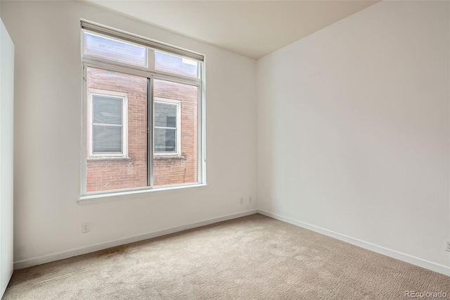 336 E 1st Ave Unit 200, Denver, CO 80203 - carpeted spare room featuring baseboards
