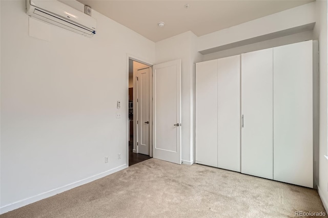 336 E 1st Ave Unit 200, Denver, CO 80203 - unfurnished bedroom featuring a wall unit AC and carpet