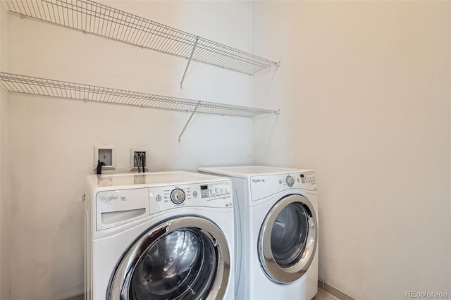 336 E 1st Ave Unit 200, Denver, CO 80203 - laundry area with washing machine and clothes dryer